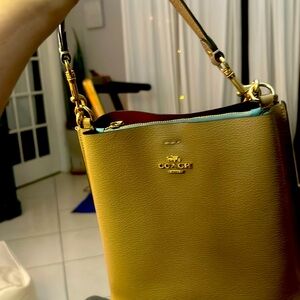 Coach purse crossbody. Used a few times. New.